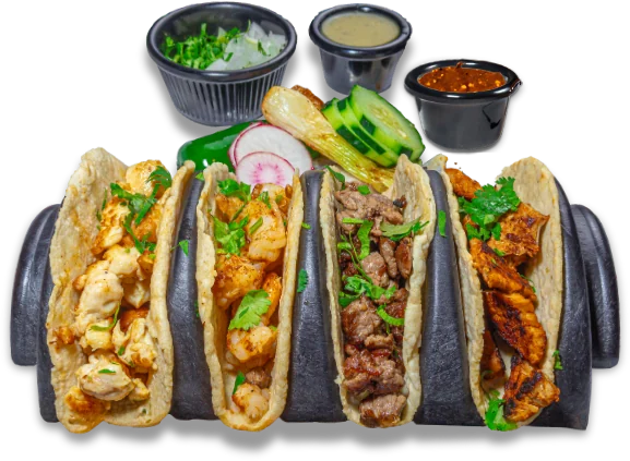 Cuatro tacos de la casa con cebolla y cilantro